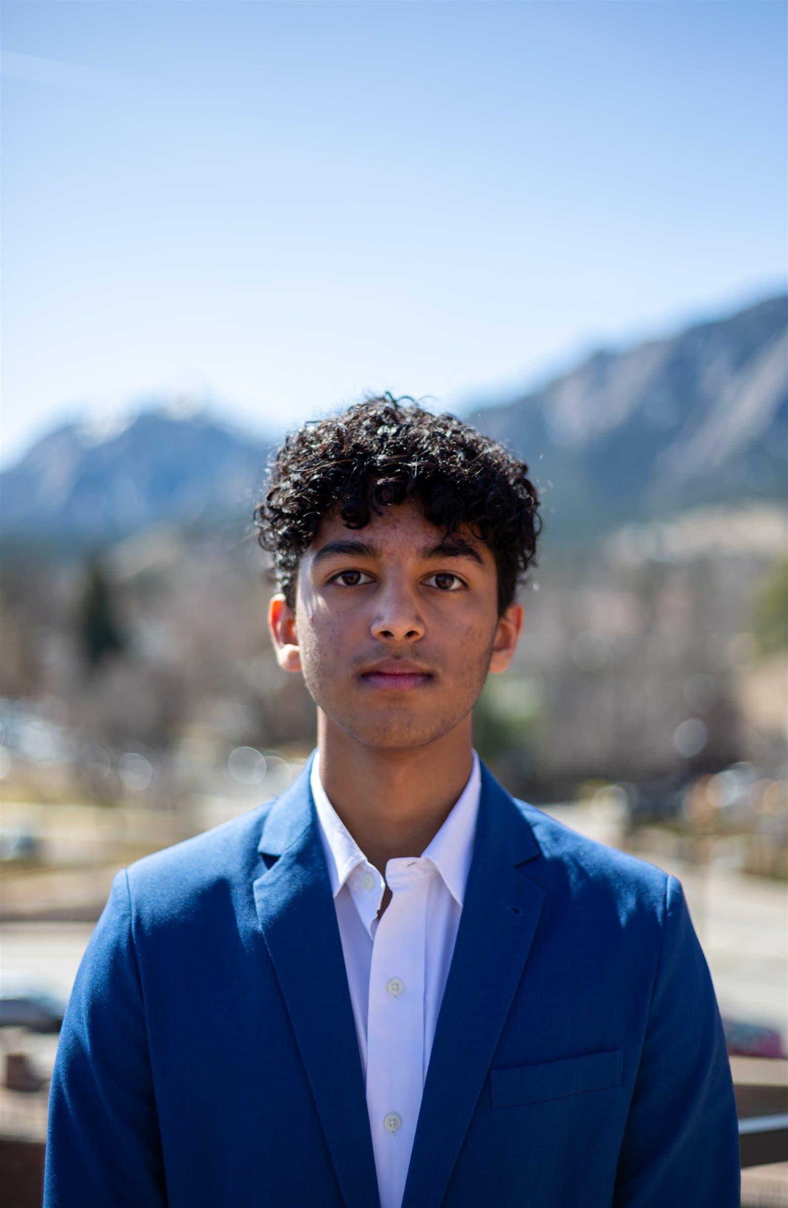 Portrait of Bhargav Sairam in front of the Flatirons in Boulder